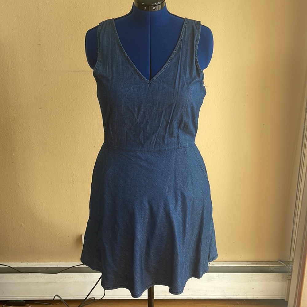 A blue sleeveless dress
